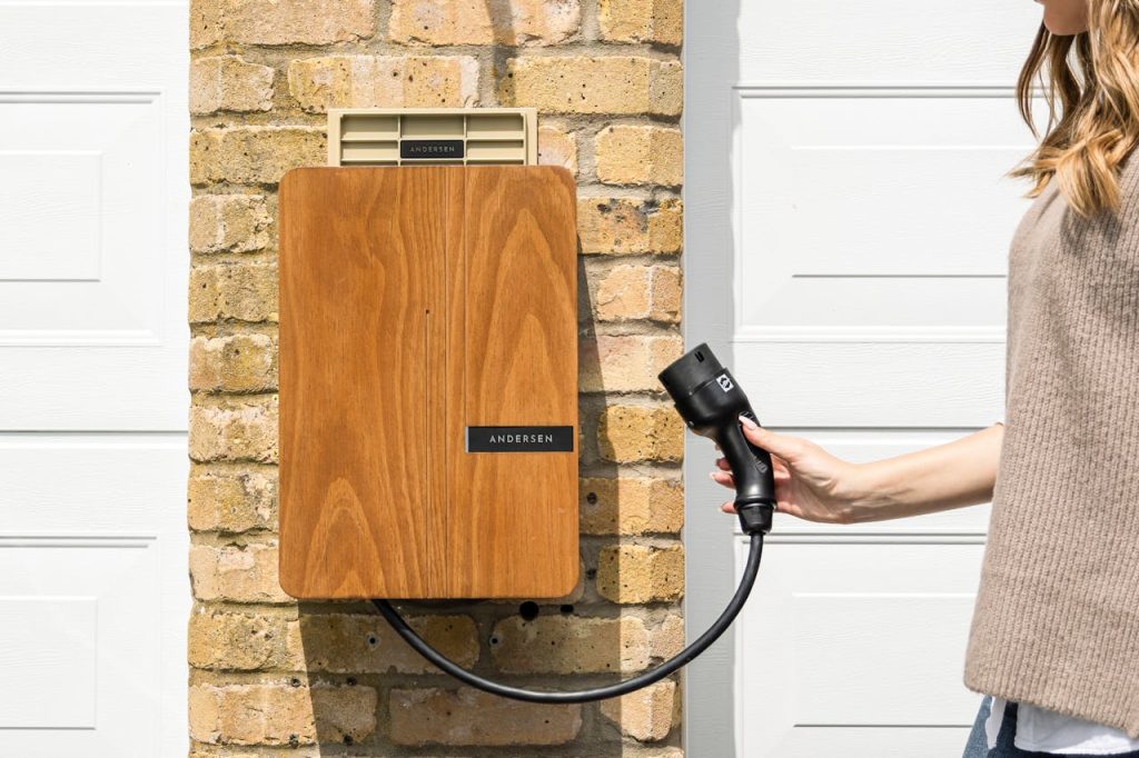 Residential EV charger mounted on a brick wall